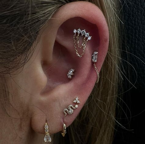 LET'S CURATE YOUR EAR‼️ @piercernomercy_ ADDED A FLAT PIERCING WITH A 14K CHAINED, MID HELIX WITH A CZ BAGUETTE END & CHAIN ATTACHMENT AND A LIL MARQUIS END IN THE CONCH FROM @invictus_bodyjewelry Soho, Union Square, and Williamsburg 11AM-9PM 7 DAYS A/W🕘 WALK-INZ OR BOOK ONLINE..📕 TATTOOS & PIERCINGS, NO ATTITUDE, NO MISERABLE HOOPS TO JUMP THROUGH....🚫 WALK-INZ WELCOME OR BOOK ONLINE AT ⚔️livebytheswordtattoo.com⚔️ . . . . #earcuration #flatpiercing #jewelry #piercing #piercer Mid Helix Piercing, Flat Piercing, Piercing Inspo, Jewelry Piercing, Union Square, Helix Piercing, Conch, Helix, Tattoos And Piercings