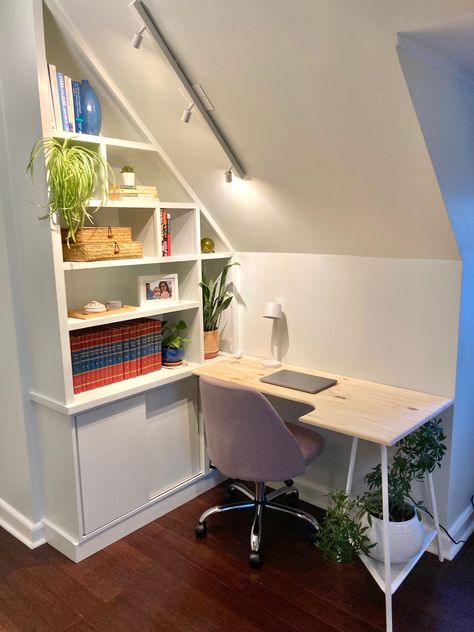 Built-in + sloped cieling + lighting = small space office solution. Small Office Slanted Ceiling, Room With Eaves Sloped Ceiling, Desk Under Sloping Roof, Small Attic Office Sloped Ceiling, Home Office Under Eaves, Desk Slanted Ceiling, Attic Study Room Ideas, Office With Sloped Ceiling, Office In Eaves