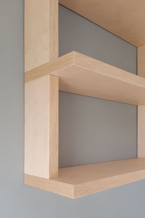 Custom TV console and bookcase design. The bookcase, in birch plywood with joints between shelves and side panels, seems to hang from the ceiling as it descends along the wall to approach the lacquered Blue base. The contrast between the simplicity of the wood, emphasized by the exposed plywood heads, and the base finished with a refined embossed lacquering, makes the piece of furniture simple and at the same time elegant and modern. Plywood Wall Shelf, Plywood Wall Shelves, Plywood Bookshelf Wall, Plywood Library, Birch Plywood Walls, Plywood Bookshelf, Plywood Bookcase, Stairwell Ideas, Plywood Design