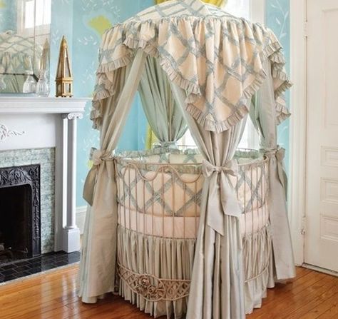 This dramatic round baby crib is a stunning focal point in the living room with a draped canopy and printed fabric Circular Crib, Round Baby Cribs, Round Crib, Baby Crib Designs, Canopy Crib, Round Cribs, Crib Design, Baby Nursery Design, Crib Canopy