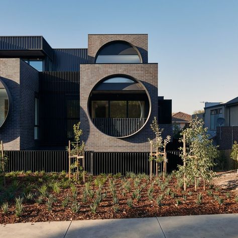 10 buildings with windows that steal the limelight Circular Windows, Melbourne Apartment, Modern Residential Architecture, Porthole Window, Modern Architecture Design, Round Window, Brick Facade, Building Facade, Facade Architecture