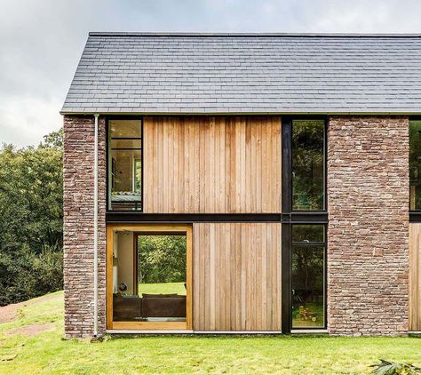 A new stone, steel and timber home in Monmouthshire blends traditional materials and forms with modern family living Architecture Renovation, House Cladding, Steel Frame House, Timber Cladding, Architecture Design Concept, Timber House, Barn Style House, Modern Barn, Design Exterior