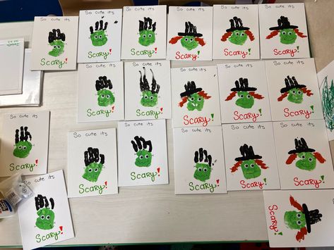 Several small canvases with Witches and Frankenstein toddler handprints. Frankenstein handprints have four black fingers, drawn on silver screw on both sides of the palm, and a green face (palm) with googly eyes, and a drawn squiggly mouth. Witch handprints have three black fingers turned into a witches hat, a green face (palm) with a draw on pointy nose and smile, with googly eyes, and painted orange hair. Frankenstein Handprint Craft, Witch Handprint, Halloween Handprint Crafts, Halloween Handprint, Handprint Craft, Handprint Crafts, Toddler Halloween, Hand Print, Halloween Witch