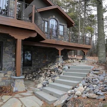 Walkout Basement Deck Ideas, Walkout Basement Landscaping Ideas, Half Walkout Basement, Walk Out Basement Exterior Ideas, Walkout Basement Exterior, Basement Walkout Patio, Walkout Basement Retaining Wall Ideas, Covered Deck Walkout Basement, Deck Over Walkout Basement