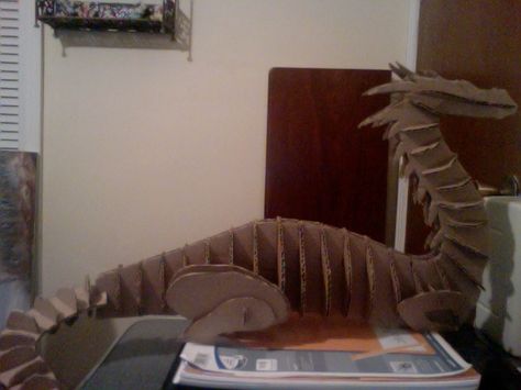 For an art project at college we had to create an animal made out of cardboard...and mine was a DRAGON! It stands about 1ft. tall, 2ft. long, and the largest it gets in width is about 6in. Cardboard Dragon Head, Cardboard Dragon, Paper Castle, Cardboard Animals, Create An Animal, Make A Dragon, Paper Masks, Sculpting Tutorials, Castle Decor