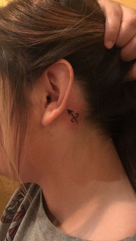 Sagittarius Arrow behind ear tattoo || April Rivera Sagittarius Arrow, Tattoo Placement Hip, Sagittarius Tattoo Designs, Small Symbol Tattoos, Quote Tattoos Girls, Sagittarius Tattoo, Constellation Tattoo, Arrow Tattoo, Arrow Tattoos