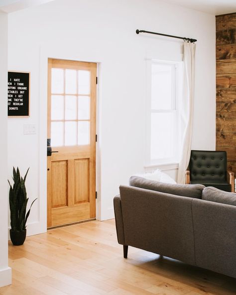 Our entryway is also our living room and it’s small so we keep it simple. We’ve got a light wood front door, light wood floors, modern gray couch, minimal decor, Letterfolk letterboard, and a faux snake plant! Grey Modern Couch, Nadine Stay, Curtain Styles, Wood Front Doors, Light Wood Floors, Remodel Bathroom, Bedroom Photos, Room Remodel, Minimal Decor