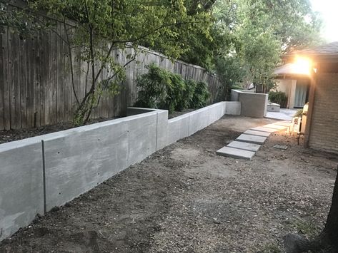 This is a concrete retaining wall GroundScape installed in Dallas Texas. If you are interested in having a retaining wall installed at your house give us call us at 817-759-0102. Black Concrete Retaining Wall, Austin Stone Retaining Wall, Quickcrete Retaining Wall, Recycled Concrete Retaining Wall, Board Form Concrete Retaining Wall, Texas Landscaping, Backyard Gates, Types Of Concrete, Concrete Retaining Walls