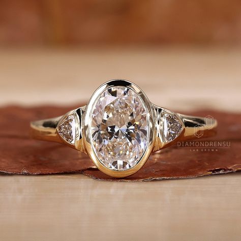 This Engagement Rings item by DiamondrensuLabgrown has 135 favorites from Etsy shoppers. Ships from India. Listed on May 28, 2024 Types Of Stone Settings, Vintage Band Engagement Ring, Old Mine Cut Bezel Ring, Art Deco Oval Ring, Inset Diamond Ring, Oval Diamond Ring With Side Stones, 3 Stone Bezel Set Ring, Three Stone Bezel Set Ring, Oval Bezel Set Engagement Ring