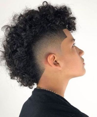 The Afro Hawk with a mid taper for black men is a dynamic hairstyle that combines the natural texture of an afro with the boldness of a mohawk. The Afro Hawk with a mid taper is not just a hairstyle; it's a statement, allowing black men to embrace their individuality with confidence and style. Afro Hawk, Frohawk Fade, Mid Taper, Man Haircuts, Curly Mohawk Hairstyles, Short Sides Long Top, Top Hairstyles For Men, Mohawk Haircut, Mohawk Hairstyles Men