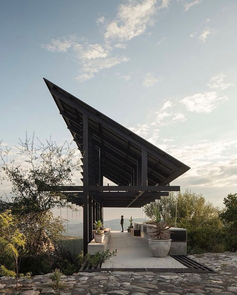 Espina Pavilion, perched atop a hill in Santiago de Querétaro! Designed by @santiagomart10 & @a.em.studio in collaboration with @matorral__, this architectural marvel harmonizes form and function with its lightweight roof and striking cantilever. The pavilion’s seamless blend with nature, earthy gabion masses, and rustically elegant tension cables make it a true work of art. 📷: @cesarbelio Dive into the full story behind this architectural gem—link in bio! #EspinaPavilion #Architecture ... Cantilever Structure, Cantilever Architecture, Timber Pergola, Get Published, Cattle Ranch, Timber Architecture, Pavilion Architecture, Pavilion Design, Pergola Attached To House