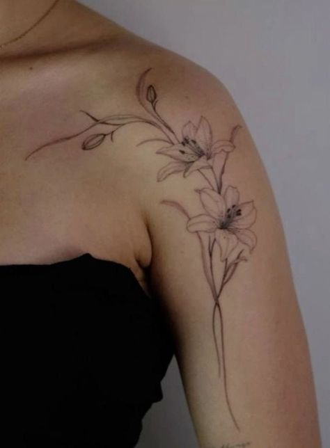 Shoulder Arm Flower Tattoo, Lilly Tattoo Arm, Flower Vine Tattoos For Women, Big Flower Tattoos, Shoulder Vine Tattoo, Word Tattoos With Meaning, Word Tattoo Ideas, Front Shoulder Tattoos, Lillies Tattoo