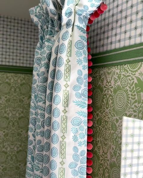 Charlotte Gaisford on Instagram: “Curtain ideas using Charlotte Gaisford fabrics, Ionian blue, Halo blizzard with check red trim and coral pom poms, Emma Verty fabrics.…” Roman Blinds With Pom Poms, Colourful Curtain Fabric, Charlotte Gaisford Curtains, Red Fabric Curtains, Coral Curtains, Blinds Inspiration, Red Floral Curtains, Charlotte Gaisford, Alaska House