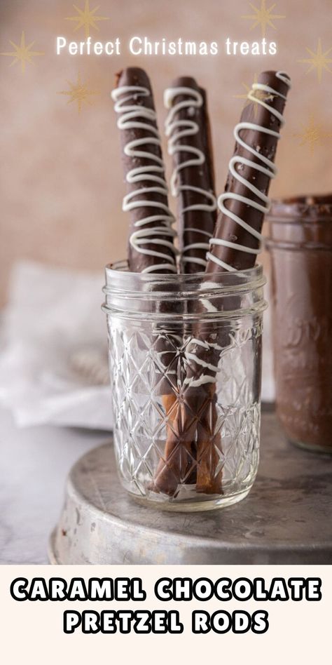 These delicious caramel chocolate covered pretzel rods are the ultimate no-bake holiday treat. Sweet and salty flavors with a perfect crunch. Pretzel With Caramel And Chocolate, Christmas Chocolate Pretzel Rods, Caramel Chocolate Pretzel Rods, Christmas Pretzel Rods, Chocolate Caramel Pretzels Rods, Caramel Pretzels Rods, Chocolate Pretzel Rods, Covered Pretzel Rods, Yogurt Covered Pretzels