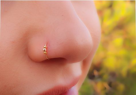 Faux Clip-On Nose Ring 24g - 14K GOLD FILLED - No Piercing Needed ♥ This adjustable nose ring is made of 14k gold filled and can also be used as a fake septum ring ♥ Comfortable, delicate Fake Nose Ring -Nose piercing hoop - 14k gold filled clip Nose Ring. ♥ The Size is adjustable 7 mm Diameter, 24 Gauge. ♥ Comfortable,light-weight and easy to use. Measurements: clip Diameter - 0.3Inch - 7mm Gauge (Thickness of the wire): 0.7mm - 22 gauge ► 100% 14k gold filled ✔ ► we ship all items in a jewelry Tiny Piercings, Tiny Nose Ring, Nose Ring Designs, Cute Nose Rings, Piercings Nose, Unique Nose Rings, Tiny Nose, Faux Nose Ring, Nose Ring Jewelry