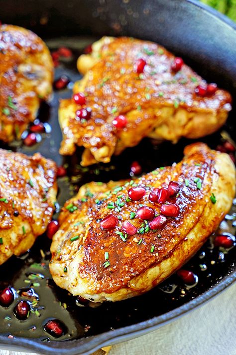 Jordanian Roasted Chicken with Pomegranate Molasses - This is packed with flavor starting with a seasoning rub of cardamom and sumac that gets rubbed under the skin prior to searing, is then roasted with pomegranate molasses, thyme and chicken stock for a juicy, tender and flavorful meal. Pomegranate Molasses Chicken, Jordanian Recipes, Molasses Chicken, Chicken With Pomegranate, Jordanian Food, Pomegranate Chicken, Molasses Recipes, Mediterranean Foods, Pomegranate Recipes