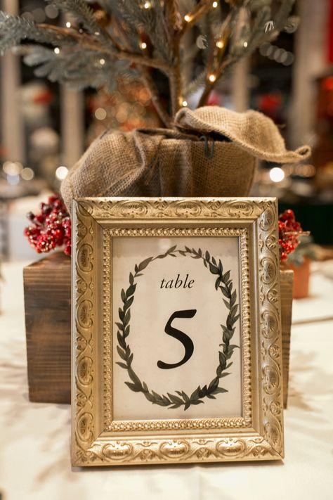 Christmas-Themed Wedding | POPSUGAR Love Christmas Party Table Numbers, December Wedding Decorations, Xmas Wedding Ideas, December Wedding Ideas, Winter Wedding Table Numbers, Christmas Wedding Centerpieces, Christmas Wedding Table, Christmas Wedding Ideas, Christmas Wedding Flowers