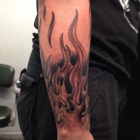 Tattoos are a great way to express yourself and stand out from the crowd. If you’re looking for something unique, bold, and eye-catching, black and gr... Tattoo Shoulder Sleeve, Fire Flame Tattoo, Chevy Tattoo, Motocross Tattoo, Tattoo Journal, Harley Tattoos, Flame Tattoo, Outer Forearm Tattoo, Tattoo Shoulder