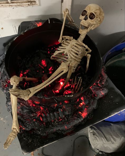 Easy DIY…spray foam, lights, kettle, spray paint, and a skeleton. Halloween Spray Foam Ideas, Spray Foam Fire Pit Halloween, Spray Painted Skeleton, Diy Spray Foam, Halloween Picks And Sprays, Spray Paint Skull, Diy Sprays, Spray Foam, A Skeleton