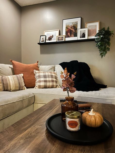 Fall Decor Brown Couch, Picture On Shelf, Simple Halloween Coffee Table Decor, Fall Pillows Living Rooms Brown Couch, Fall Decor Floating Shelves, Shelf Halloween Decor, Room Decor Finds, Fall Entry Tabke Blanket, Picture Shelf