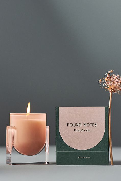 Find, keep, share. Designed exclusively at Anthropologie, Found Notes makes a bright, modern statement with sculptural vessels and a range of uplifting fragrances. Rose & Oud (Floral Woody): Damask rose, nutmeg, and saffron intertwine with rich rose noire, leather, and cedarwood, settling into a seductive blend of patchouli, guaiacwood, and amber. For the best burn experience, keep the following in mind: The first time you light your candle, allow it to burn until the wax pool melts all the way Anthropologie Home Candles, Modern Candle Packaging, Candle Vessel Ideas, Luxury Candle Packaging Design, Candle Package Design, Candles Anthropologie, Luxury Product Packaging, Candle Packaging Ideas, Luxury Candles Packaging