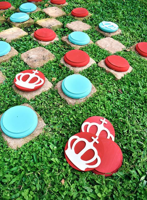 If you love big fun you're going to adore these DIY giant checkers. They are super easy to make and provide so much fun and quality one-on-one time! Spray Paint Yard Games, Diy Giant Checkers, Diy Giant Chess Pieces, Outdoor Game Ideas, 4th Of July Party Games, Diy Checkerboard, Outdoor Checkers, Giant Checkers, Game Crafts