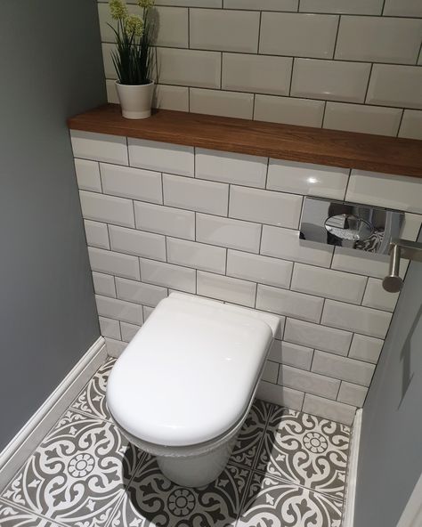 Weekend revamp in our downstairs cloakroom, most satisfying revamp to date! New back to wall toilet, metro tiles and Devonstone grey floor tiles with a complimenting solid oak shelf. Total perfection. Drømme Bad, Small Downstairs Toilet, Cloakroom Toilet, Bathroom Under Stairs, Toilet Ideas, Downstairs Cloakroom, Toilet Room Decor, Small Toilet Room, Grey Floor Tiles