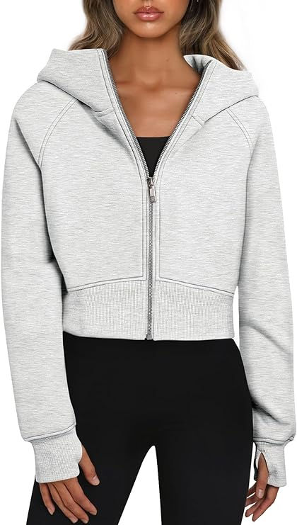 My women's zip-up hoodie cropped sweatshirt is an absolute must-have in my closet. It effortlessly combines comfort and style in one chic package. The cropped design not only adds a trendy touch but also allows me to show off some of my favorite high-waisted bottoms. Whether I'm layering it over a tank top for a relaxed day or wearing it as a standalone statement piece, this sweatshirt is my go-to choice. Wardrobe Decoration, Fall Sweatshirt Outfit, Autumn Fabric, Zipper Shorts, Workout Attire, Winter Tops, Fall Sweatshirt, Zip Up Hoodies, Cardigan Fashion