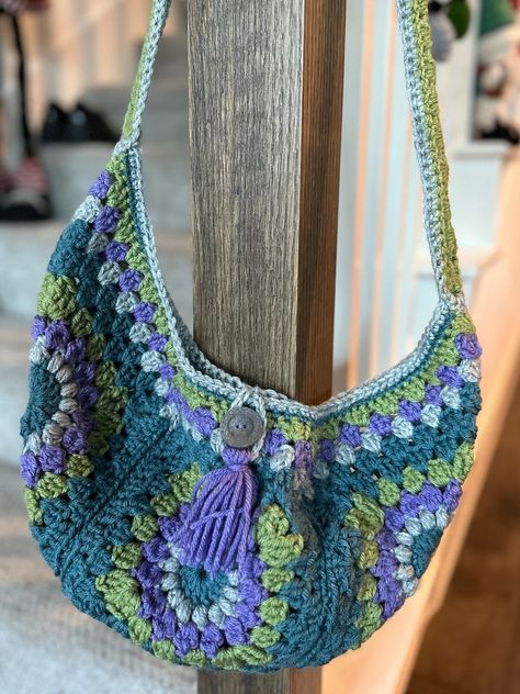 Boho chic crossbody bag with granny square design. Features button closure, adjustable shoulder strap, and interior Crochet Bag Two Color, Quirky Crochet, Crochet Sunburst, Granny Square Purse, Granny Square Crochet Bag, Square Crochet Bag, Knitting & Crochet Tools, Sunburst Granny Square, Chic Purses