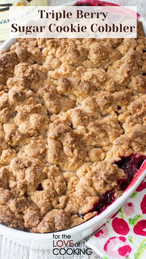 This triple berry sugar cookie cobbler is a deliciously sweet mixed berry cobbler with a buttery sugar cookie topping.   New Recipe ~ Triple Berry Sugar Cookie Cobbler   Link: https://fortheloveofcooking.net/recipe/triple-berry-sugar-cookie-cobbler  #recipes #cobbler #blackberries #raspberry #strawberry #dessert #fruitdessert #berries #berrydelicious Crumbl Triple Berry Cobbler Cookie, Cookie Crumble Recipe, Cookie Cobbler, Triple Berry Crisp, Triple Berry Cobbler, Mixed Berry Dessert, Raspberry Cobbler, Mixed Berry Cobbler, Triple Berry Pie