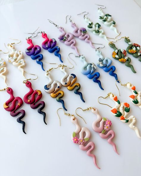 snakes are back!! which is your favorite?!!👀 they drop this saturday may 11 at 1pm pacific🐍💕 Polymer Snake Earrings, Clay Snake Ideas, Snake Polymer Clay Earrings, Silk Clay Ideas, Clay Snake Earrings, Clay Snake, Polymer Clay Flower Jewelry, Diy Earrings Polymer Clay, Polymer Clay Figures