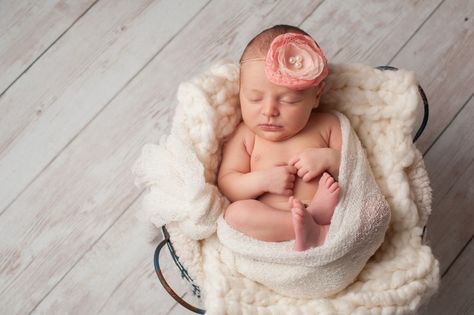 A portrait of a beautiful, seven day old, newborn baby girl wearing a large, fabric rose headband. She is swaddled with gauzy fabric and sleeping in a wire basket. Vintage Baby Girl Names, High Key Portrait, Cool Baby Girl Names, Low Key Portraits, Newborn Baby Portraits, Summer Presets, Wedding Presets, Lightroom Presets Collection, Lightroom Presets Bundle