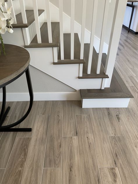 White Oak Floors Staircase, Stair And Floor Contrast, Wooden Tiles Staircase, Light Wood Floors Dark Stairs, Tile Floor Wood Stairs, Dark Staircase Light Floors, Contrasting Stairs And Floor, Dark And Light Floor Transition, Dark Hardwood Stairs