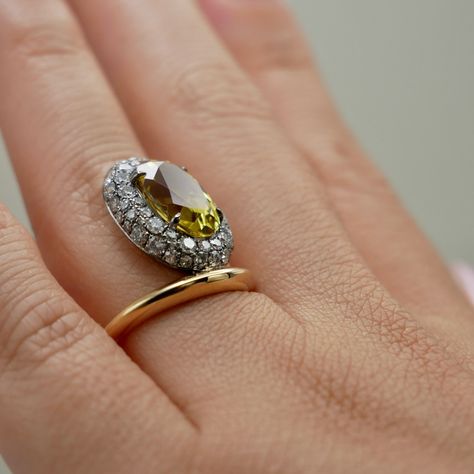 Circle of sparkle, heart of gold 💛 Meet our yellow oval sapphire ring, embraced by a dazzling donut of pave diamonds in every shape. It’s not just a ring, it’s a masterpiece that turns heads and steals hearts! 🌟 . . . . . #EternalElegance #YellowSapphireRing #OvalSapphire #PaveDiamonds #UniqueRings #LuxuryJewelry #FineJewelry #StatementRing #JewelryDesign #CustomJewelry #GemstoneRings Donut Ring, Oval Sapphire Ring, Yellow Sapphire Rings, Beauty Features, Antique Gift, Brooch Jewelry, 3 Carat, Yellow Sapphire, Gold Band