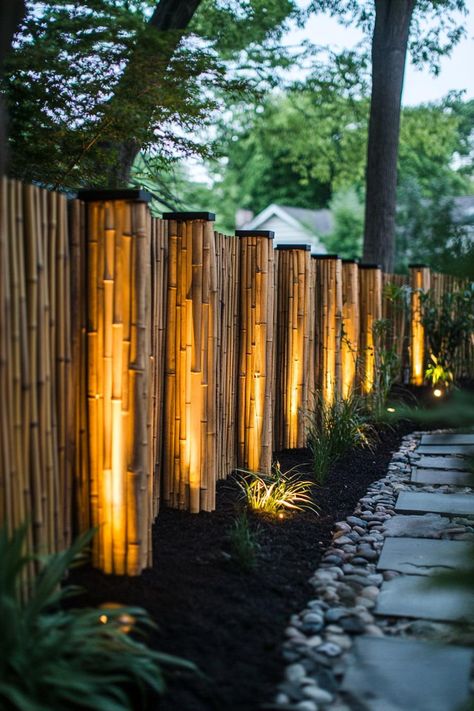 Bamboo fence with solar lights backyard privacy seating section. Discover creative bamboo privacy fence ideas that will transform your outdoor space into a secluded paradise. Solar Lights Backyard, Bamboo Privacy Fence, Lights Backyard, Backyard Solar Lights, Privacy Fence Ideas, Bamboo Privacy, Backyard Privacy, Patio Fence, Bamboo House