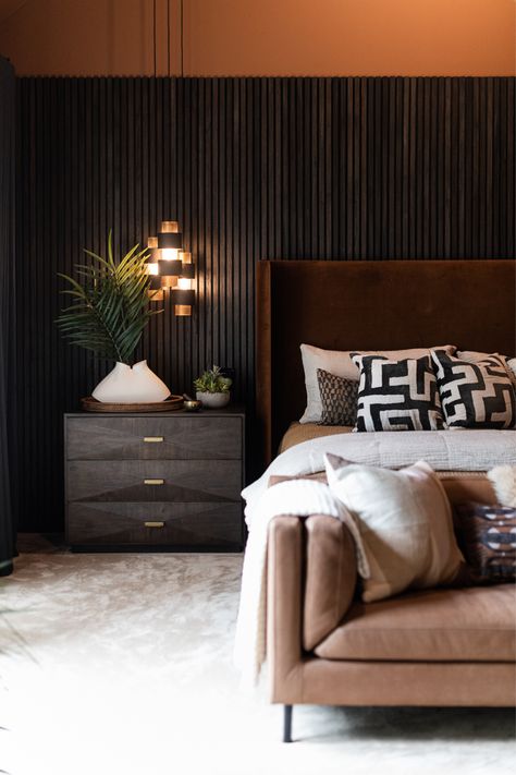 moody primary bedroom designed by violet marsh interiors Moody Primary Bedroom, Wood Headboard Bedroom, Dark Brown Bedrooms, Wood Walls Bedroom, Walnut Bedroom Furniture, Walnut Bedroom, Feature Wall Bedroom, Earthy Bedroom, Cozy Texture