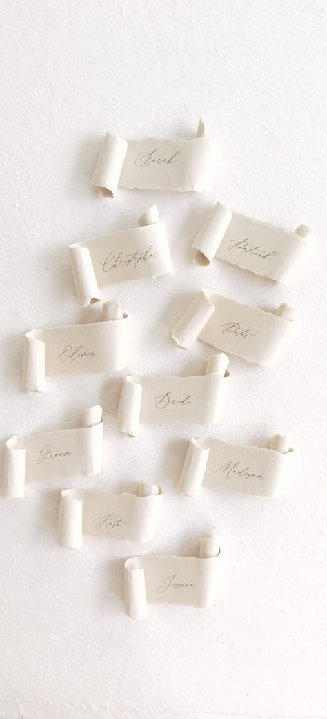 Handmade paper scroll place cards Scroll Place Cards, Vellum Paper Place Cards, Classic Menu Design, Scroll Seating Chart, Placecards Wedding Table, Wedding Name Place Cards Wax Stamp, Handmade Paper Place Cards, Wedding Name Place Cards Hand Written, Diy Scroll