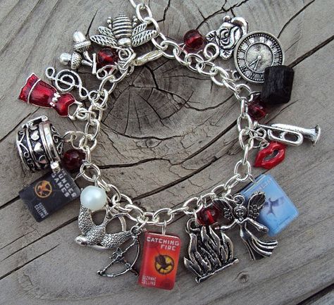 Love. Too bad it $50..... Hunger Games Bracelet, Hunger Games Jewelry, Mockingjay Pin, Fandom Jewelry, Hunger Games Fandom, The Bling Ring, Computer Shortcuts, Hunger Games 3, Hunger Games Series