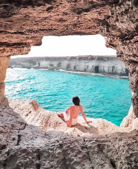 Ayia Napa, Cyprus 🇨🇾 This beautiful shot captures a hidden gem along the coast of Ayia Napa, Cyprus. The view from a natural sea cave opens up to the sparkling blue waters of the Mediterranean. Ayia Napa is famous for its stunning beaches, crystal-clear waters, and vibrant nightlife, but scenes like this showcase its serene and untouched coastal beauty. Ayia Napa Cyprus, Cyprus Paphos, Paphos Cyprus, Seaside Hotel, Sea Cave, Ayia Napa, Beach Wedding Photos, Beach Yoga, Beachy Boho