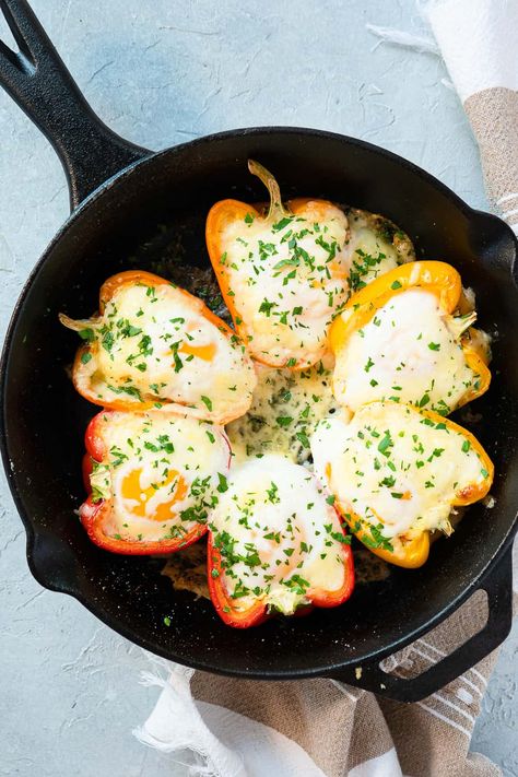 Oven Baked Eggs in Peppers are a perfect make-ahead individual breakfast for busy weekdays or an elegant breakfast casserole for a crowd. It's an easy recipe with an egg, ham, and cheese baked right in it's own bell pepper shell! Breakfast Potluck Ideas For Work, Breakfast Casserole For A Crowd, Breakfast Potluck Ideas, Traditional Shakshuka Recipe, Potluck Ideas For Work, Casserole For A Crowd, Elegant Breakfast, Oven Baked Eggs, Breakfast Potluck