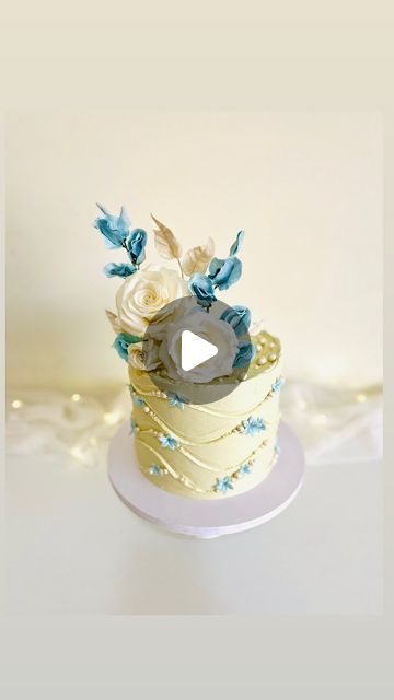 Maffy’s Cake Boutique on Instagram: "Wave Cake 🤍💙🤍  How to create a perfect wave Effect .🙌🏻  ~Place a well-coated, perfectly smooth cake on the turntable.  ~Use buttercream or any soft cream for this design.   ~Don’t use ganache.  ~Apply at least a 1/4’ thick layer of Buttercream to create waves.  ~Use  a small lightweight scraper   ~Lightly press the bottom corner of the scraper on the cake. ~Make sure to press the bottom corner into the cake slightly.  ~Rotate the cake in a wave like movement and move your hand gradually upwards to create the waves.  ~No need of sharp edges for this design . (All you need is practice )  ~Use an offset spatula to create a spiral design in the center of the cake.  Colors: & Pearl Ivory luster @sugarflaircoloursltd  Sugar paste @meister_pastry   #wavec Cake Colors, Wave Cake, Offset Spatula, Buttercream Designs, Cake Boutique, Smooth Cake, Sugar Paste, Spiral Design, Cake Tutorial