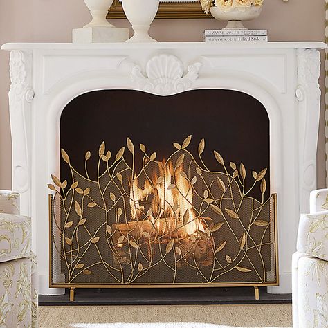 The lacy branch and leaf design was created by our own talented artist. Our Branches Fire Screen is handmade of powder-coated iron and decorated with beautifully detailed leaf details. An antique brass finish is hand applied to give this decorative fireplace guard a warm, golden glow. Branches Fire Screen features: Antique brass finish with gold accents Leaf & branch details Handmade of powder-coated iron Rust-resistant Boho Fireplace Screen, Fireplace Gate Ideas, Brass Fireplace Fender, Brass Vent Covers, Decorating With Brass Accents, Fireplace Insert Decor, Inside Fireplace Decor, Faux Fireplace Decor, Fireplace Screen Ideas