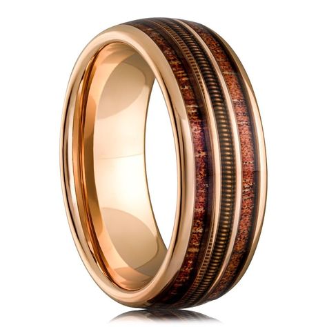 PRICES MAY VARY. Unique Design: The Guitar String Whiskey Barrel Men's Wedding Ring features a striking rose gold and tungsten blend with a genuine whiskey barrel wood inlay and an intricately woven guitar string, making it a unique and meaningful symbol of your love for music. Recycled Materials: Crafted with sustainability in mind, this ring showcases a blend of recycled materials, making it an eco-friendly choice. Durable and Scratch-Resistant: Made from robust black tungsten, this ring is de Men’s Gold Band, Men’s Engagement Rings, Mens Unique Wedding Bands, Whiskey Barrel Rings, Unique Mens Wedding Bands, Wedding Ring Images, Rose Gold Mens Wedding Band, Promise Ring For Him, Mens Wedding Rings Unique