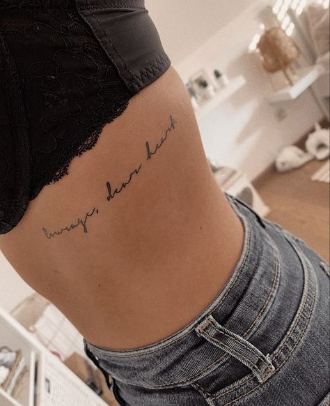 Heart Broke Tattoos, Courage Quotes Tattoos, Underboob Quote Tattoo, Courage Dear Heart Tattoo, Rib Tattoos For Women Quotes, Waist Tattoo, Courage Tattoos, Fear Tattoo, Underboob Tattoo Designs