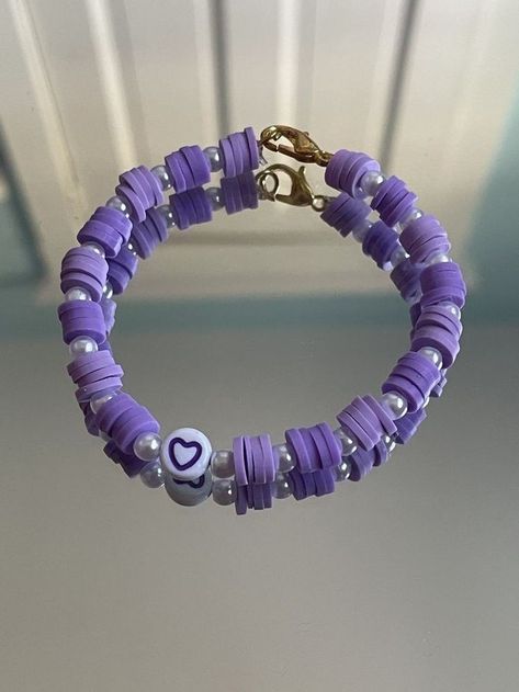 Beads Bracelet Design Purple, Beaded Purple Bracelets, Purple Clay Beads Bracelet, Pink And Purple Clay Bead Bracelet, Clay Bead Bracelet Ideas With Pearls, Purple Clay Bead Bracelet Ideas, Clay Bead Bracelet Ideas Valentines, Clay Beaded Bracelets Ideas, Purple Bracelet Ideas