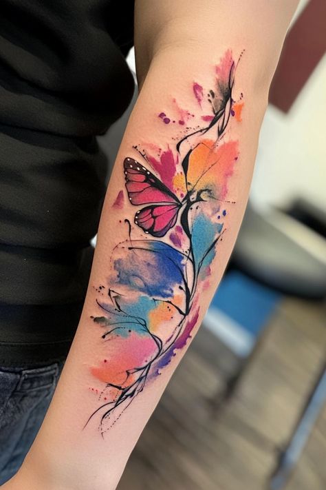 Colorful abstract tattoo of a butterfly and leaves on a person's forearm. Body Art Styles, Watercolor Tattoos For Women, Watercolor Tattoo Design, Watercolor Phoenix Tattoo, Watercolor Heart Tattoos, Watercolor Wolf Tattoo, Watercolor Tattoo Tree, Dreamy Watercolor, Watercolor Hummingbird