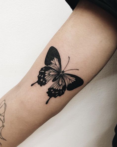 Black butterfly tattoo on the right arm by Finley Jordan Jordan Tattoo, Black Butterfly Tattoo, Butterfly Tattoos, Butterfly Tattoo Designs, Waves Tattoo, Dream Tattoos, Pattern Tattoo, Black Butterfly, Small Tattoo