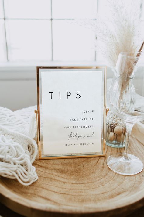 "This wedding tips sign template features modern minimalist fonts. Place it at your wedding bar table beside a tips jar, or just display the sign on its own. Includes multiple sizes for US/CA/AU/EU/UK. You can easily edit the names, change the color or font, and upload images as needed. Save, download, and print from home or at your local print shop - try the demo below!  See Matching Items in the Liv Collection: http://etsy.me/39JdU5h TRY THE DEMO  * * * * * * * * * * * * *  - Try the Demo at Corjl, copy and paste link into your browser: https://www.corjl.com/d/515OMA TIP: Desktop editing is best. Mobile and Tablet editing are not full-featured. WHAT YOU RECEIVE * * * * * * * * * * * * *  You will receive this template(digital files). It includes the \"Tips\" Sign.  US/CA * Tips Sign 4x6\ Wedding Bar Tip Jar Ideas, Bartender Tips, Wedding Bartender, Wedding Drink Menu Sign, Wedding Bar Menu Sign, Wedding Drink Menu, Nae Nae, Bar Menu Wedding, Tip Jars