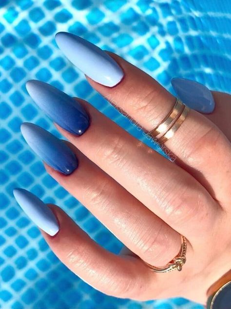 Navy ombre nails in an almond shape Nails 2023 Trends Summer Almond Blue, Ombre Nails Almond Blue, Summer Nails 2023 Almond Blue, Blue Ombre Dip Nails, Trendy Nails Ideas 2024 Summer Almond, Blue Ombre Nails Almond, Navy Blue Ombre Nails, Baby Blue Ombre Nails, Royal Blue Ombre Nails