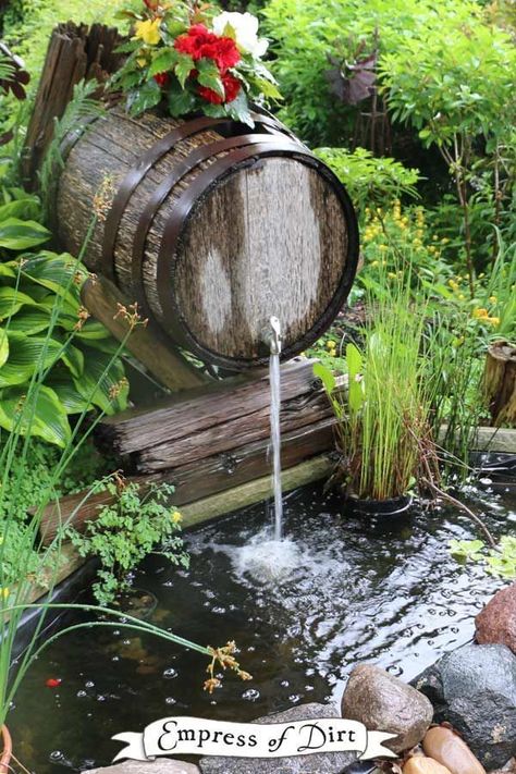 Wooden barrel waterfall over a backyard garden pond. Come see more creative pond ideas. #waterfall #DIY #empressofdirt Kolam Air, Taman Air, Diy Pond, Fountains Backyard, Garden Waterfall, Pond Waterfall, Pond Landscaping, Backyard Water Feature, Waterfalls Backyard